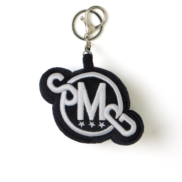 Black SMG Embroidered Plush Logo Charm