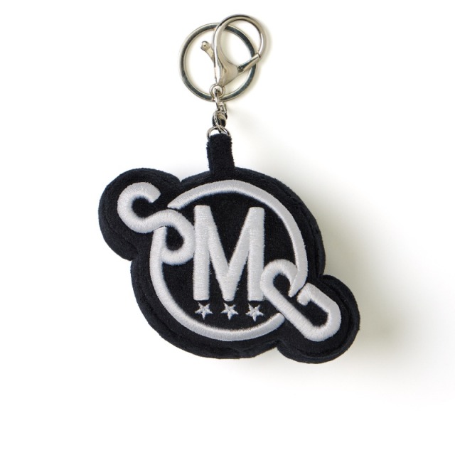 Black SMG Embroidered Plush Logo Charm